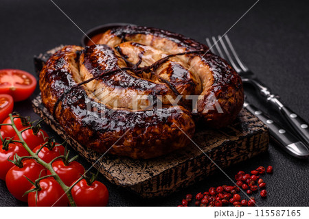 Delicious grilled sausage in the form of a ring with salt, spices 115587165