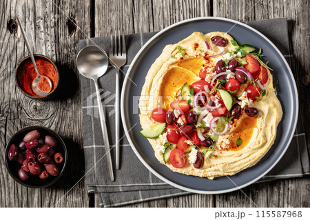 Greek hummus with veggies, olives, feta on plate Greek hummus with veggies, olives, feta on plate 115587968