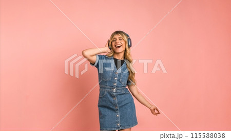 Cheerful transgender woman dancing while listening to music 115588038