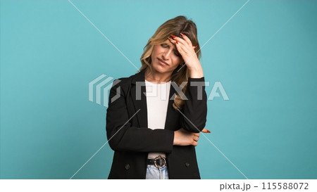 Tired transgender businesswoman suffering from headache 115588072