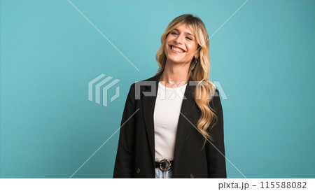 Cheerful transgender businesswoman looking at camera as she laughs on blue background 115588082