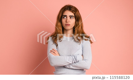 Doubtful woman with thoughtful expression in pink studio Doubtful woman with thoughtful expression in pink studio 115588120