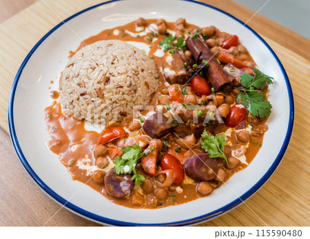 A vegetarian massaman curry in a bowl with sweet potato and many spices A vegetarian massaman curry in a bowl with sweet potato and many spices 115590480