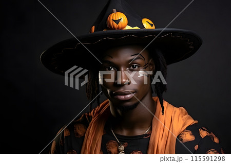 African man is depicted wearing a Witch Hat and Pumpkin Decor for a Halloween Costume Portrait 115591298