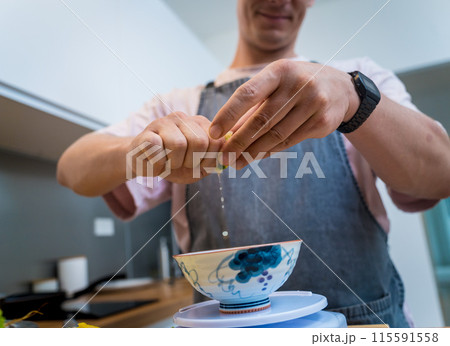 Chef at the kitchen preparing spicy glass noodle salad Chef at the kitchen preparing spicy glass noodle salad 115591558