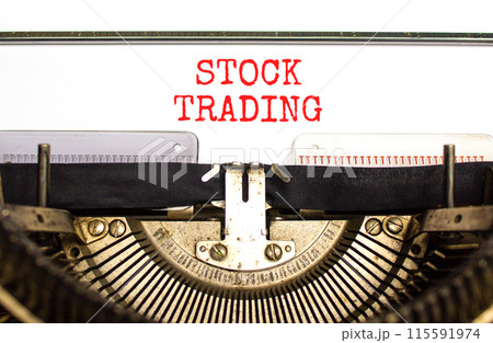 Stock trading symbol. Concept words Stock trading typed on beautiful old retro typewriter. Beautiful white paper background. Business stock trading concept. Copy space. 115591974