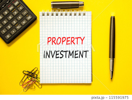 Property investment symbol. Concept words Property investment on beautiful white note. Beautiful yellow paper background. Calculator. Black pen. Business Property investment concept. Copy space. 115591975