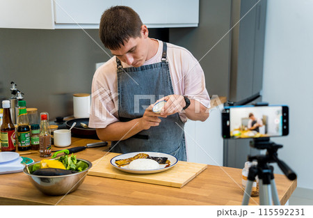 The chef is broadcasting live from workshop how to prepare a grilled eggplants with garlic The chef is broadcasting live from workshop how to prepare a grilled eggplants with garlic 115592231