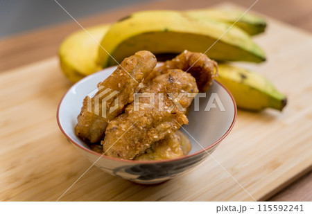 Crispy fried bananas in the small white bowl 115592241