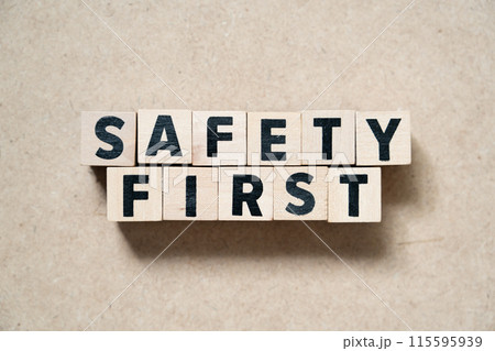 Alphabet letter block in word safety first on wood background 115595939