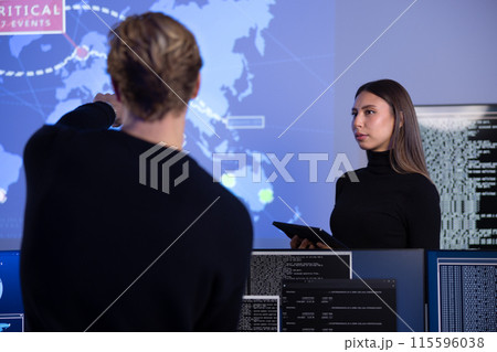 Cyber security team working in a Cyber Security Operations Center SOC to protect systems and technologies Cyber security team working in a Cyber Security Operations Center SOC to protect systems and technologies 115596038