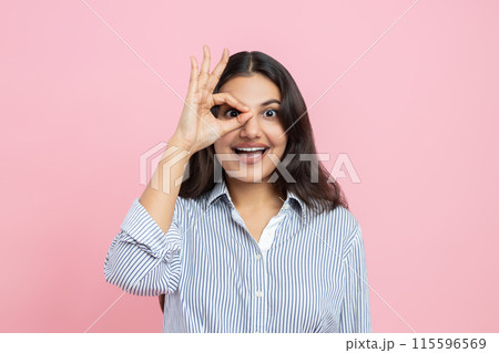 Happy positive Indian woman showing ok gesture Happy positive Indian woman showing ok gesture 115596569