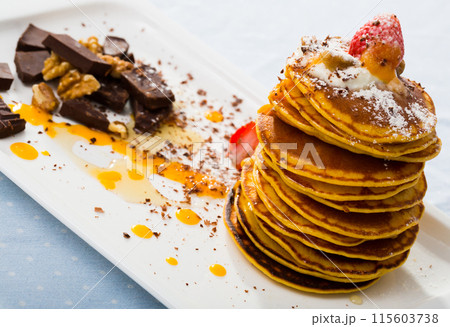 Pumpkin pancakes with sauce 115603738