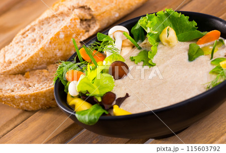 Mushrooms cream soup with grain baguette Mushrooms cream soup with grain baguette 115603792
