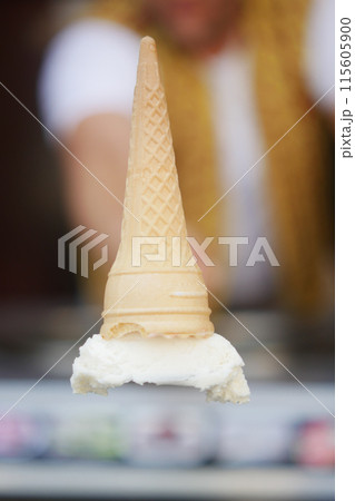 Make a fun dessert with an upsidedown ice cream cone on a scoop for a whimsical touch 115605900