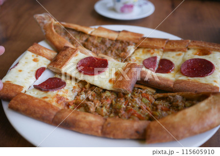 Turkish pide traditional food with beef and vegetables. 115605910