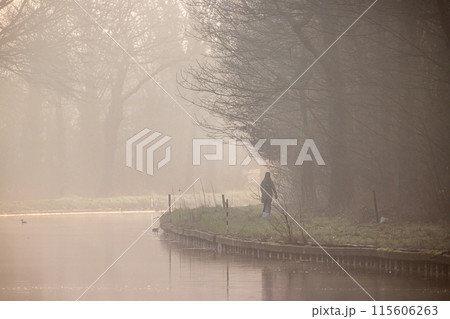Tranquil morning walk by misty river with peaceful atmosphere and beautiful nature Tranquil morning walk by misty river with peaceful atmosphere and beautiful nature 115606263