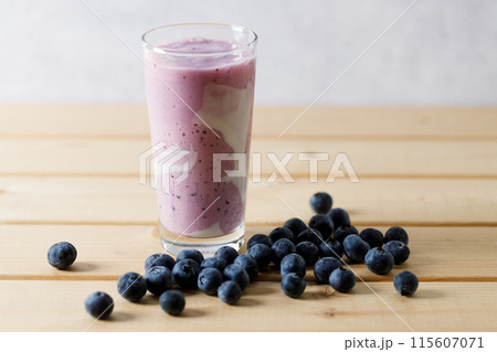 Blueberry smoothie with yogurt in a glass. 115607071