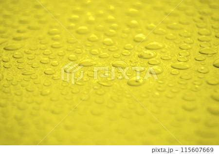 Water droplets on yellow cover background. Water droplets concept. 115607669