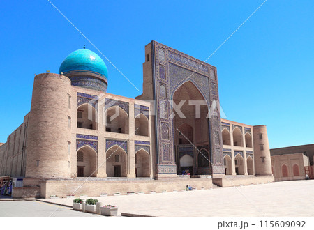 Facade of Mir i Arab madrassa, Bukhara, Uzbekistan. Madrasah Mir Arab, Poi-Kalyan (Poi Kalon) islamic religious complex in old town in Bukhara. Inscription above the entrance is a quote from the Koran 115609092