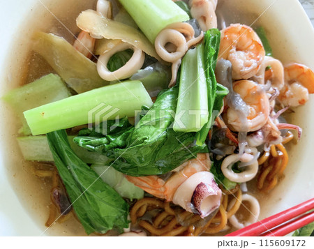 Top view of Gravy noodle served with seafood. Asian food concept 115609172