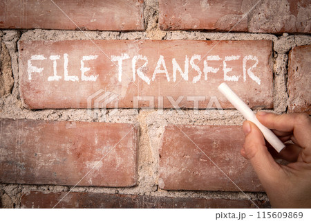 File Transfer. Text written with white chalk on a red brick background File Transfer. Text written with white chalk on a red brick background 115609869