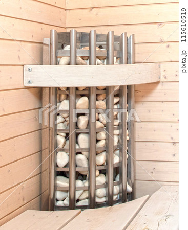Lava stones on the sauna stove Lava stones on the sauna stove 115610519