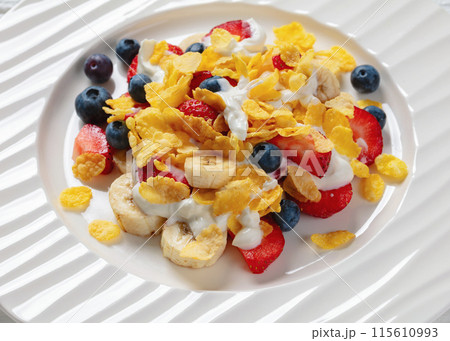 fresh berries, banana with corn flakes and yogurt fresh berries, banana with corn flakes and yogurt 115610993