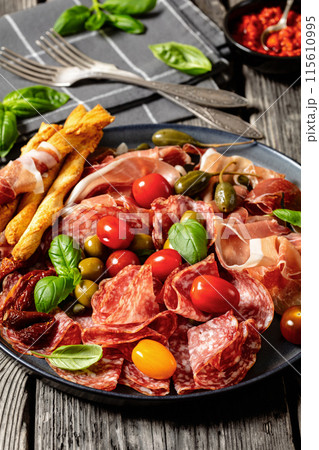 italian antipasto plate of cured meat and veggies italian antipasto plate of cured meat and veggies 115610995