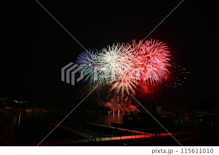 Beautiful colorful fireworks with reflections in water. Brno dam, the city of Brno-Europe. International Fireworks Competition. Beautiful colorful fireworks with reflections in water. Brno dam, the city of Brno-Europe. International Fireworks Competition. 115611010