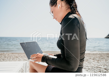 woman laptop sea. Working remotely on seashore. Happy successful lady, freelancer working on sea beach, relieves stress from work to restore life balance. Freelance, remote work on vacation 115612586