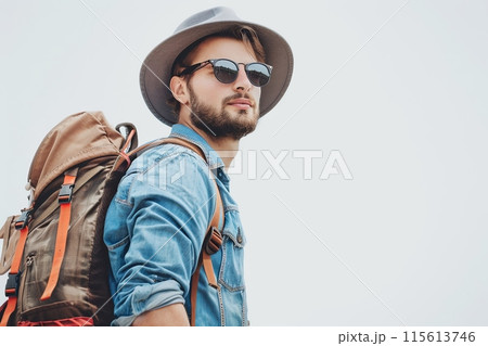A man in a denim shirt, sunglasses, hat, and backpack on a white background. Generative AI 115613746