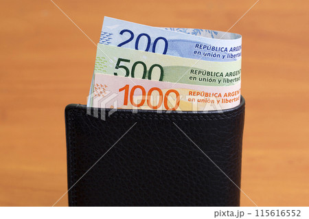 Argentine peso in the black wallet 115616552