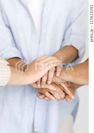 European senior woman, teen girl and adult mom put hands on hands, isolated on white studio background. Female generation, power together, love, relationship, team and family support European senior woman, teen girl and adult mom put hands on hands, isolated on white studio background. Female generation, power together, love, relationship, team and family support 115618391