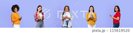Happy millennial diverse women bloggers in casual use smartphones, isolated on violet studio background, panorama. Social networks app, lifestyle and chat remotely, video online 115619520