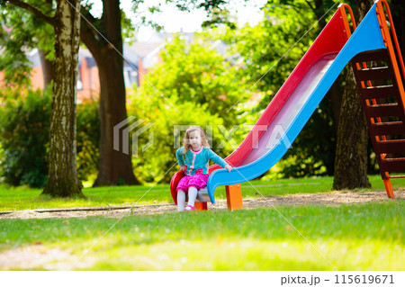 Kids explore nature. Children play in sunny park. 115619671