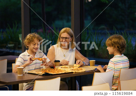 Family eating pizza. Italian restaurant. Family eating pizza. Italian restaurant. 115619884