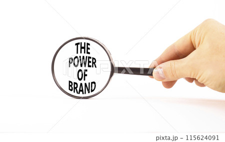 The power of brand symbol. Concept words The power of brand on beautiful magnifying glass. Beautiful white table white background. Businessman hand. Business the power of brand concept. Copy space. The power of brand symbol. Concept words The power of brand on beautiful magnifying glass. Beautiful white table white background. Businessman hand. Business the power of brand concept. Copy space. 115624091