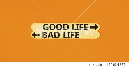 Good or bad life symbol. Concept word Good life Bad life on beautiful wooden stick. Beautiful orange table orange background. Business and Good or bad life concept. Copy space. 115624271
