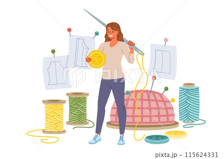 Woman seamstress holds large needle and button standing near threads for making handmade clothes 115624331
