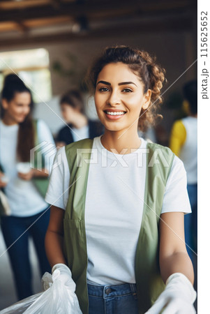 Smiling Woman in Green Vest Holding a Bag Smiling Woman in Green Vest Holding a Bag 115625652
