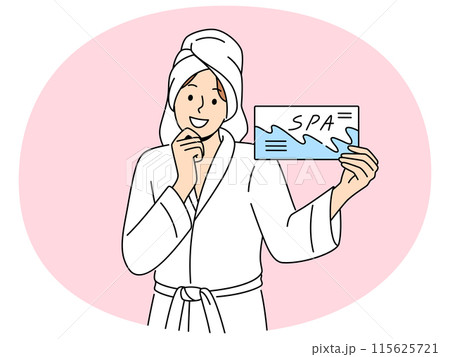 Smiling woman with spa voucher in hands 115625721