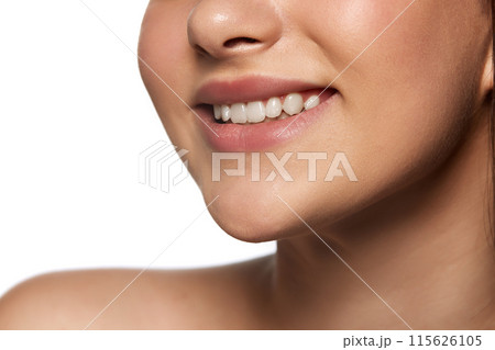 Cropped image of female face, girl smiling isolated on white background. Ten whitening, dental care, health check up 115626105