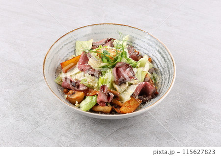 salad with roast beef and potatoes poured with truffle sauce salad with roast beef and potatoes poured with truffle sauce 115627823