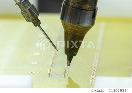 Close up scene the automatic soldering machine operation with PCB board. Close up scene the automatic soldering machine operation with PCB board. 115629584