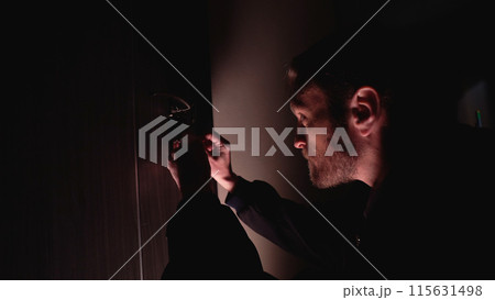 Dangerous criminal attempts to enter a private flat by unlocking the door with a picklock 115631498