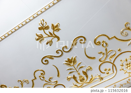 White ceiling decoration with golden bas relief gypsum details 115632016