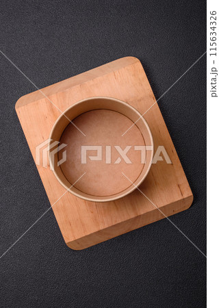 Empty ceramic round plate on dark textured concrete background Empty ceramic round plate on dark textured concrete background 115634326