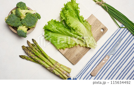Raw asparagus, broccoli and spices on white background 115634492