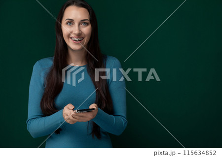Woman Holding Cell Phone in Hands 115634852